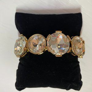 GOLD TONE  & CUT GLASS ELASTICIZED FASHION BRACELET.